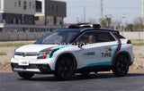 Diecast model car with white body, teal blue stripe, and black roof, front three-quarter view
