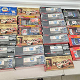 Boxed diecast toy car display with multiple racing model packages