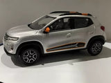 NOREV 1:43 diecast model car of a silver-gray SUV with black wheels and orange details