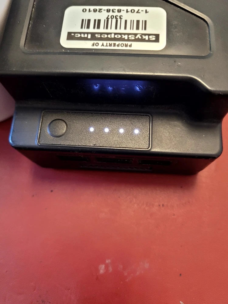Intelligent flight battery charging port with metal contacts and indicator light