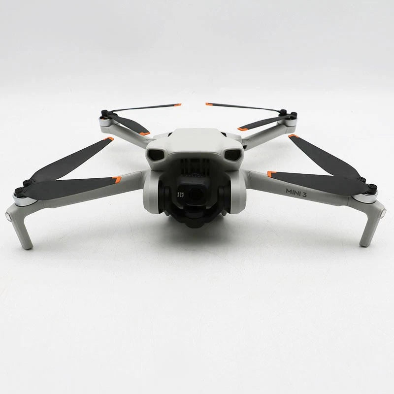 Dji Mini 3 drone with front camera and four white propeller arms