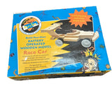 Wooden race car model kit box with battery-operated car parts and instructions