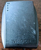 WHOOP 4.0 battery pack, dark blue/black rectangular shell with WHOOP logo