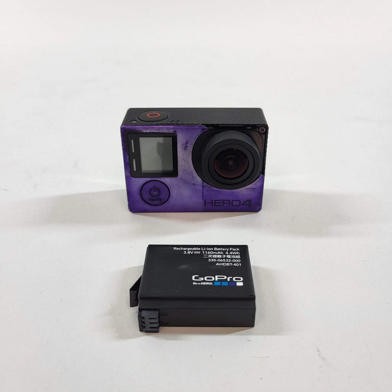 GoPro Hero4 action camera with purple housing, front display, and battery pack