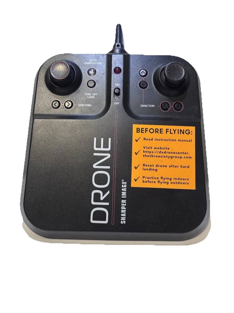 Drone remote control with two thumb joysticks, antenna, and instruction label
