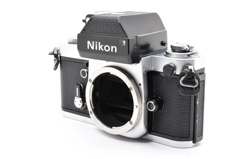 Nikon F2 Photomic silver 35mm SLR film camera with black leatherette grip, front lens mount