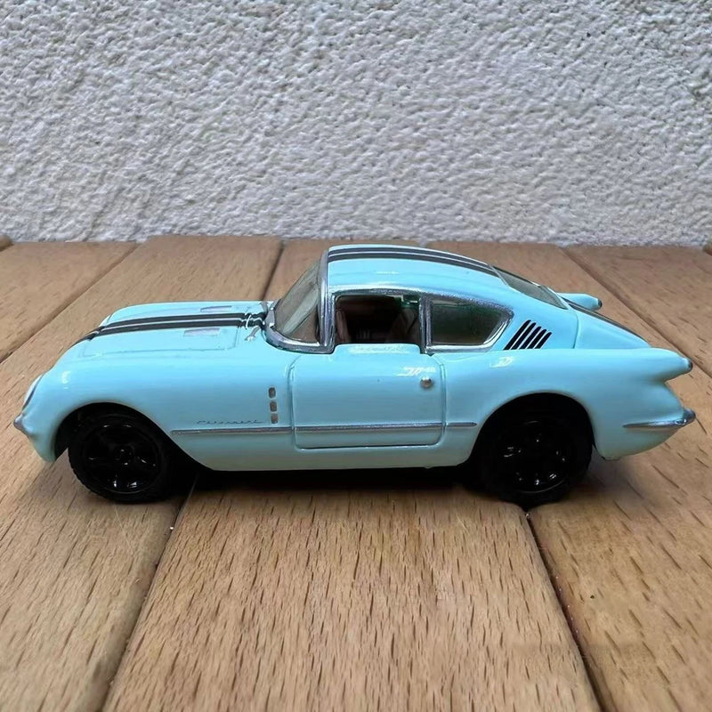 1:64 scale 1954 Tosta light blue model car, side view, black wheels
