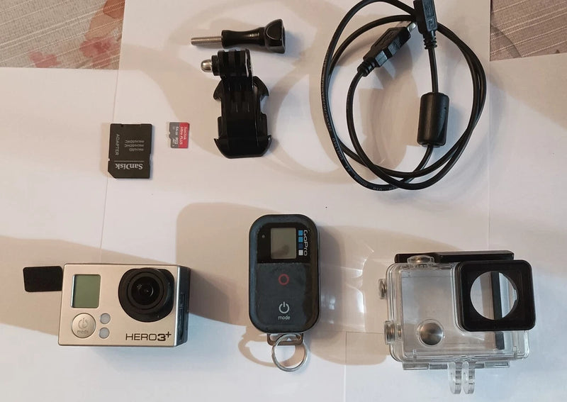 GoPro HERO3+ Plus silver action cam with clear waterproof case and mounting accessories