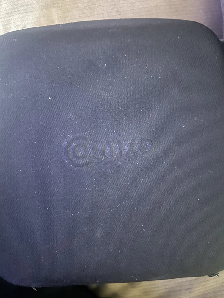 Dark drone body panel with circular power symbol