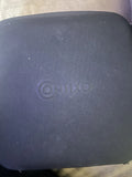 Dark drone body panel with circular power symbol