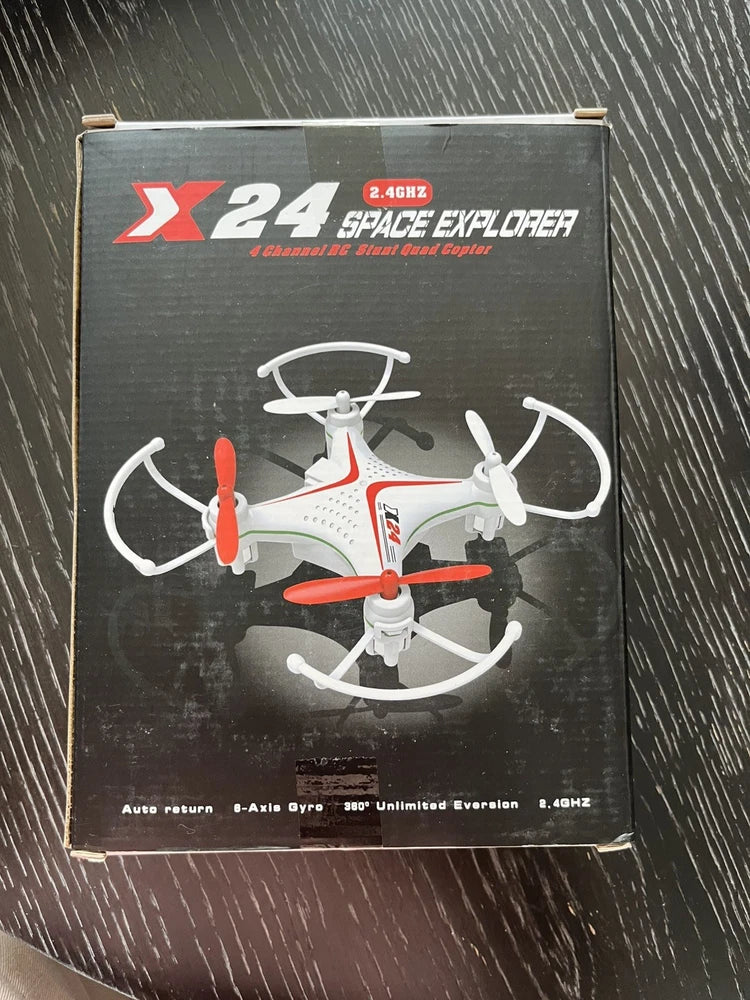 Mini drone in retail box, white frame with red propellers, 4-rotor design