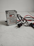 Johnson battery charger with clip, labeled control box and attached power cord