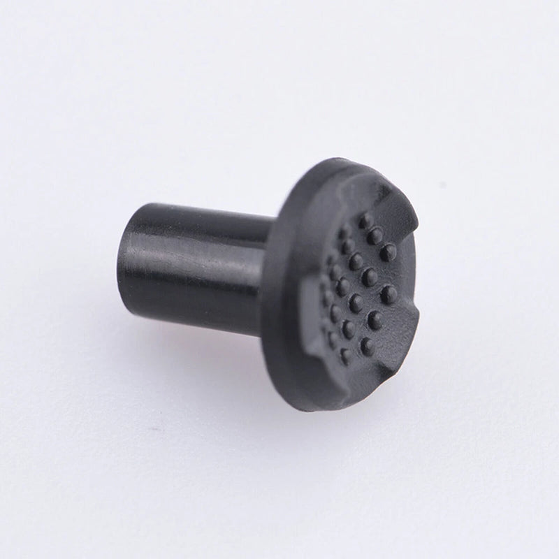 Rubber key button cap cover with textured circular pad and cylindrical base, dark gray