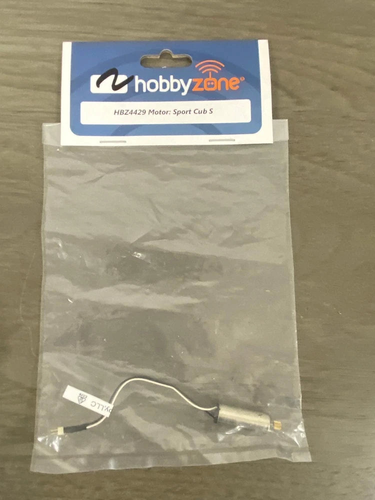 Replacement RC airplane motor with attached wire leads, in sealed protective bag