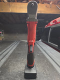 Milwaukee M12 FUEL red and black right-angle impact wrench with battery base