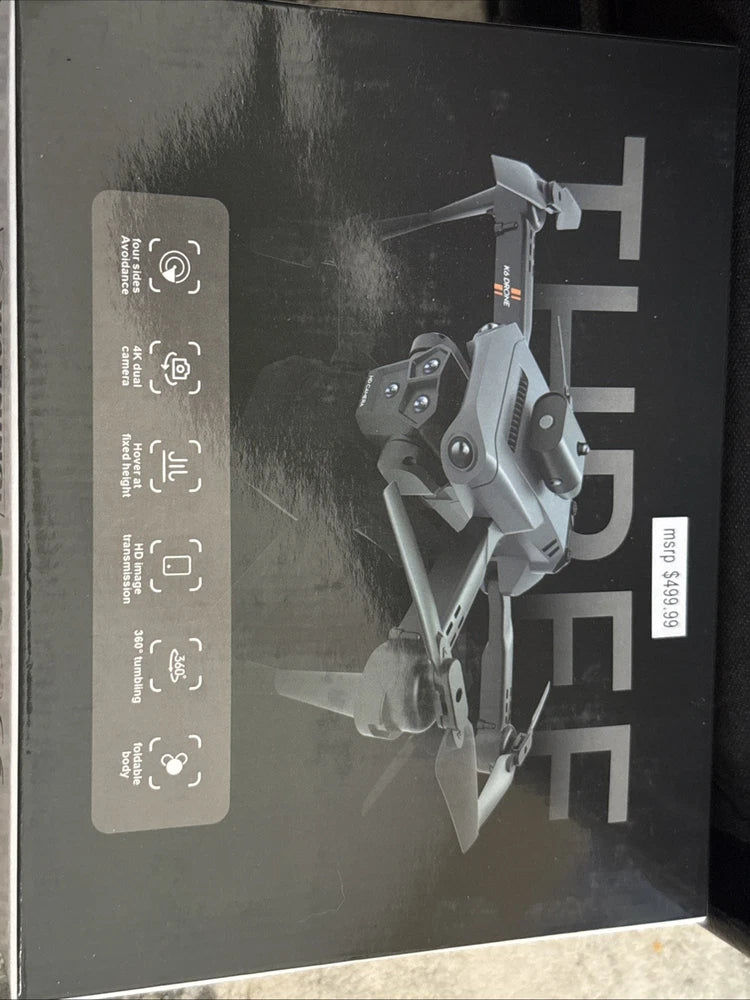 Grey foldable remote control drone shown on product box