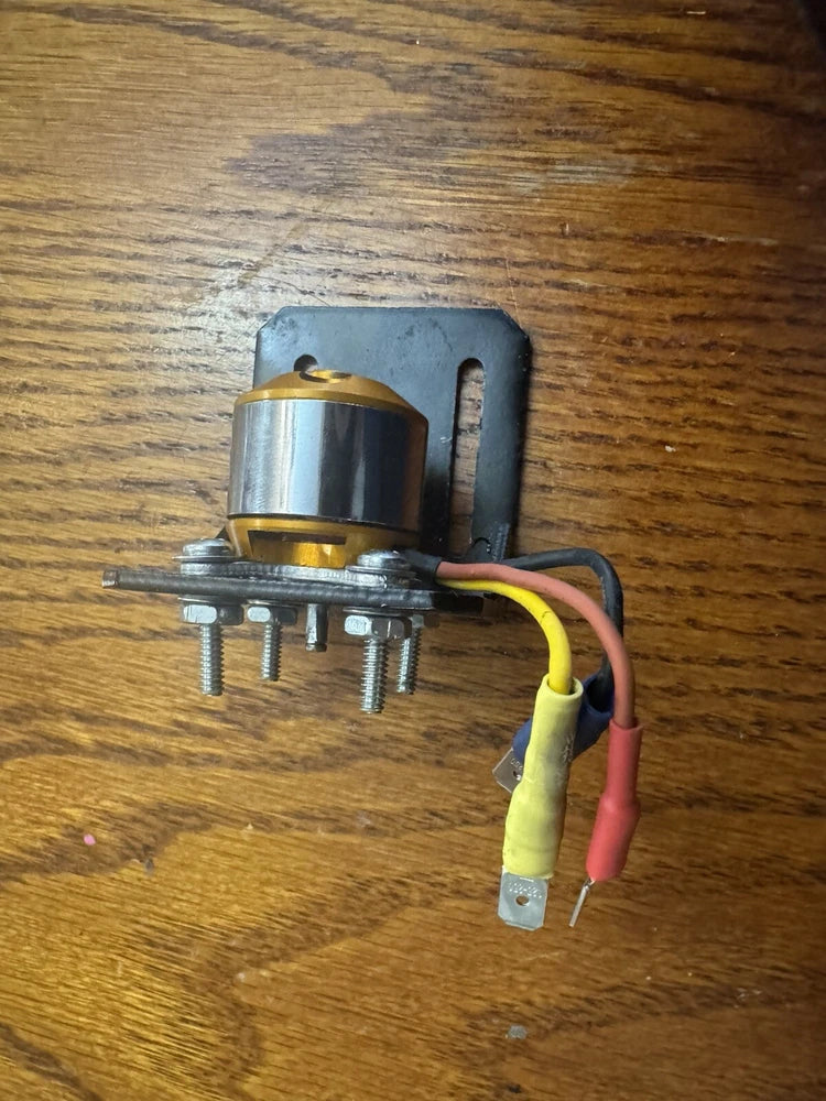 Modified RC drone motor with metal mounting bracket and red, yellow, black wires