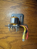 Modified RC drone motor with metal mounting bracket and red, yellow, black wires