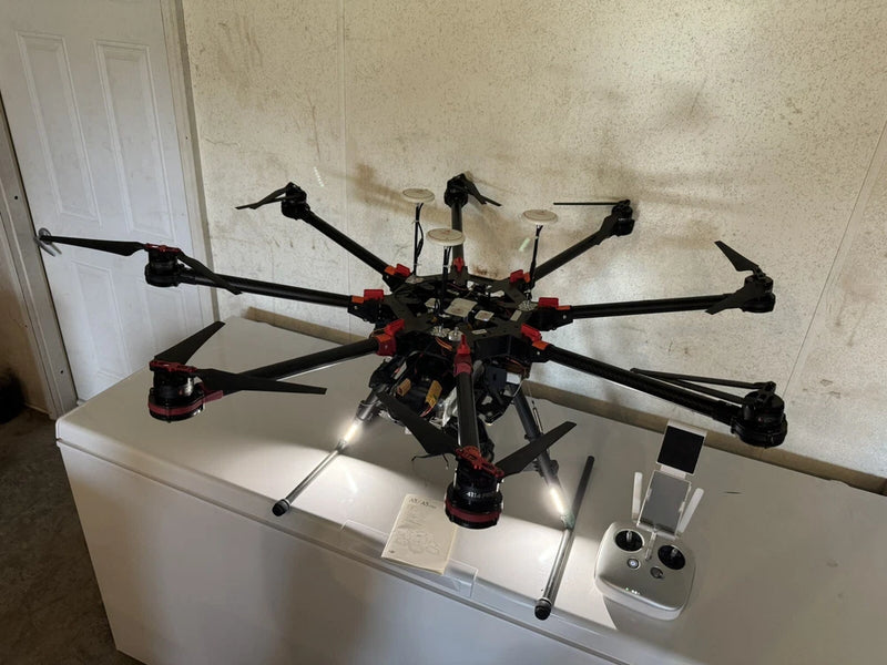 Multi-rotor heavy lift drone with six arms and propellers, with remote controller