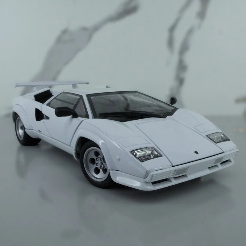 White die-cast sports car model with black side intakes, front three-quarter view