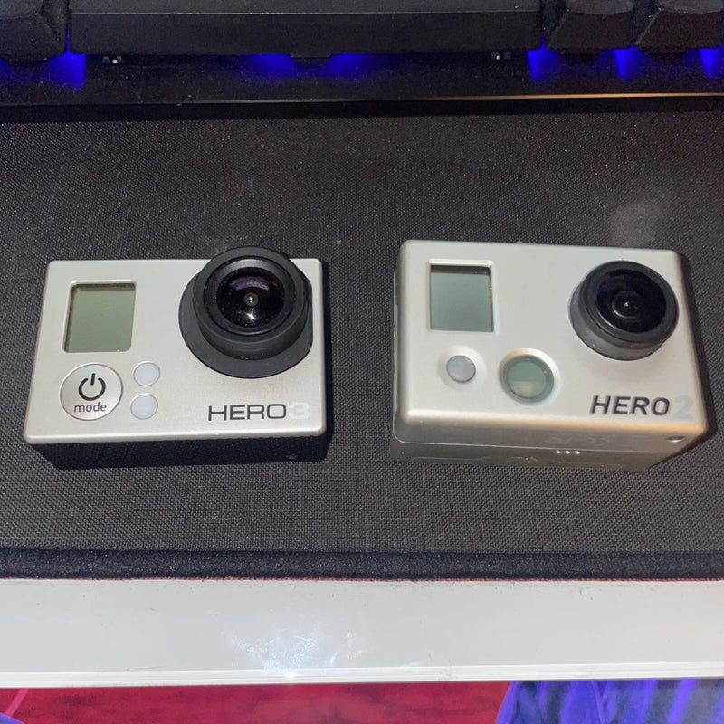 GoPro HERO action cameras in waterproof housings, two units side by side