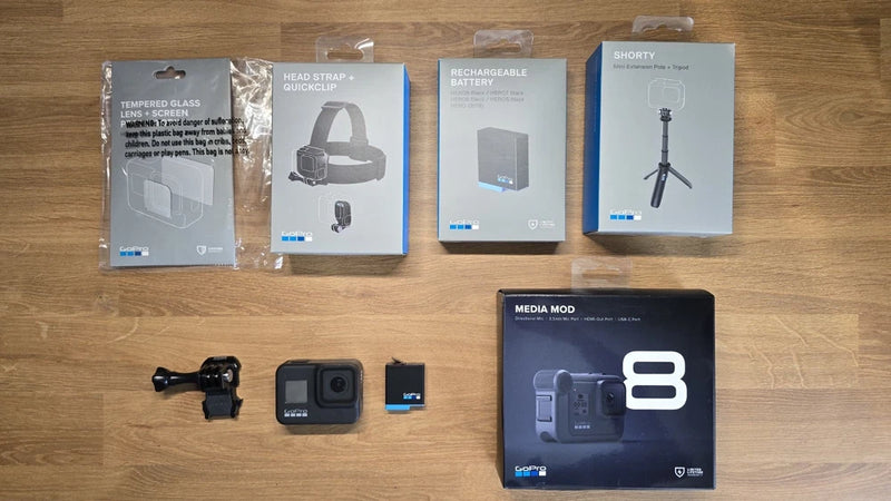 Black action camera kit with Media Mod, spare battery, charger, and mount