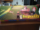 RC airplane kit box with Superfly branding and 'almost ready to fly'