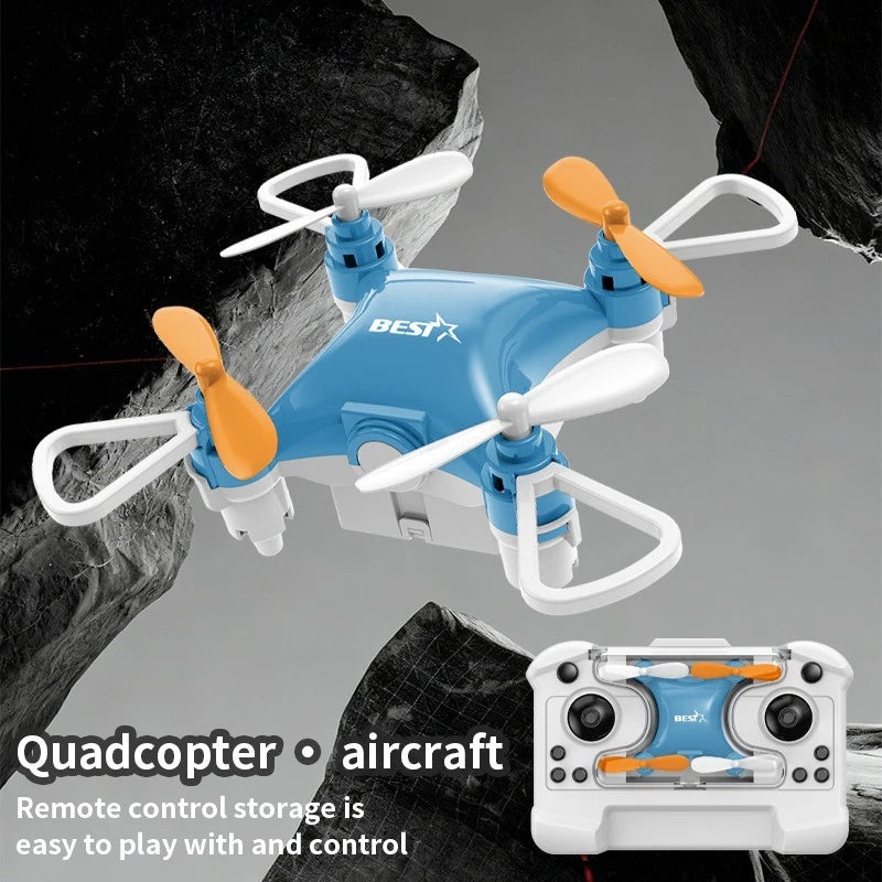Mini quadcopter aircraft with orange propellers and white BESTX remote controller
