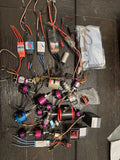 RC drone motor lot with multiple wired motors and connectors, various colors