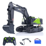 Remote control excavator model with remote controller and battery pack, green accents
