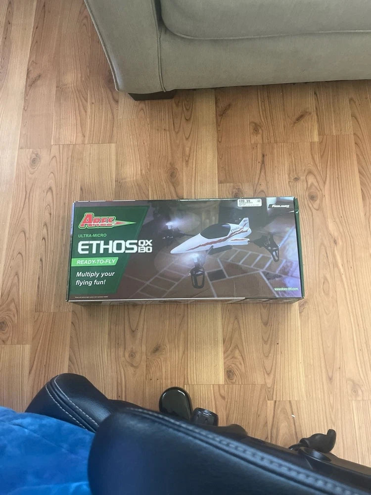 Ready-to-fly drone retail box with drone artwork and product label
