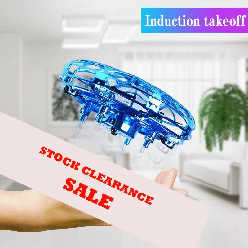Blue mini RC helicopter drone with spinning-style rotor ring, held by hand