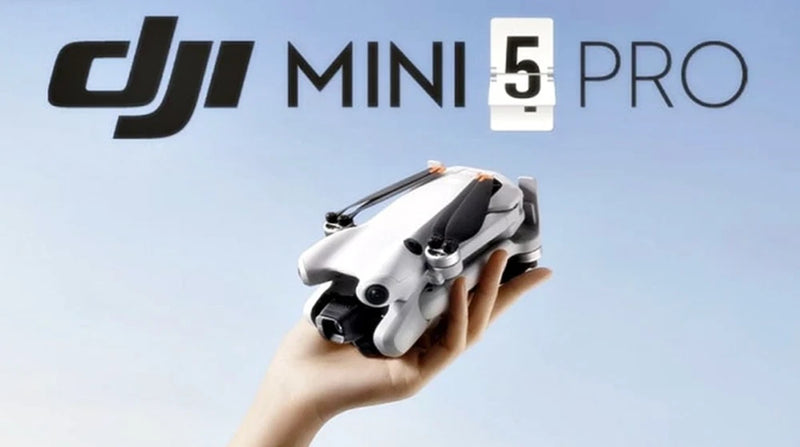 DJI Mini 5 Pro drone, gray foldable quadcopter held in a hand