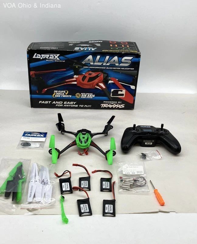 Green quadcopter drone spare parts lot with controller, props, batteries, and screws