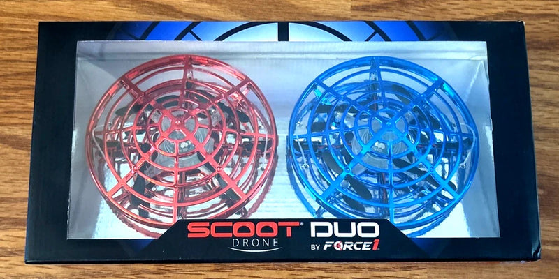 Scoot Duo hand-operated drone set with red and blue circular frames, LED lights