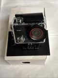 Waterproof sports action camera in clear housing, black body and large circular lens