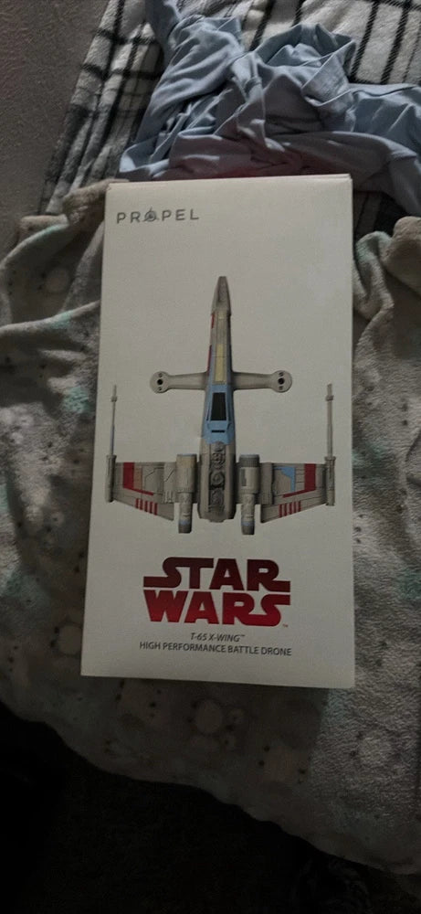 Propel T-65 X-Wing battle drone box with quadcopter illustration in gray, blue, and red
