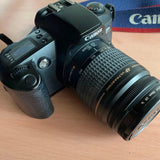 Canon EOS Kiss 2 film camera with EF 28-80mm lens, black body and zoom ring