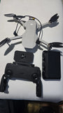 DJI Mavic Mini camera drone with controller and phone mount, front view