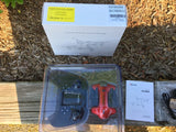 Drone kit in clear plastic tray with blue and red parts and manual