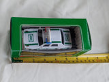 White and green battery toy patrol car model in green retail box