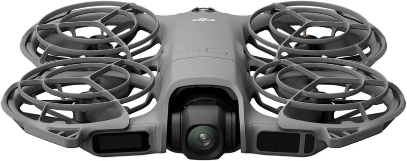 Light gray foldable quadcopter drone with front camera lens and four propellers