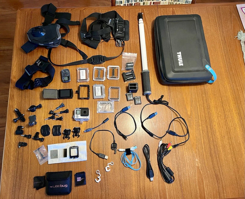 GoPro HERO4 Black action camera kit with case, mounts, and assorted accessories