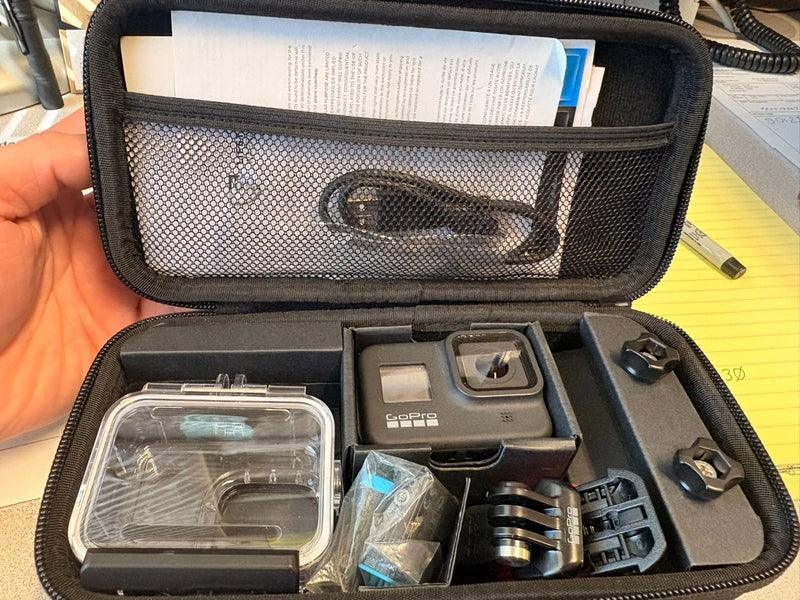 GoPro HERO action camera bundle in zippered case with waterproof housing and mounts