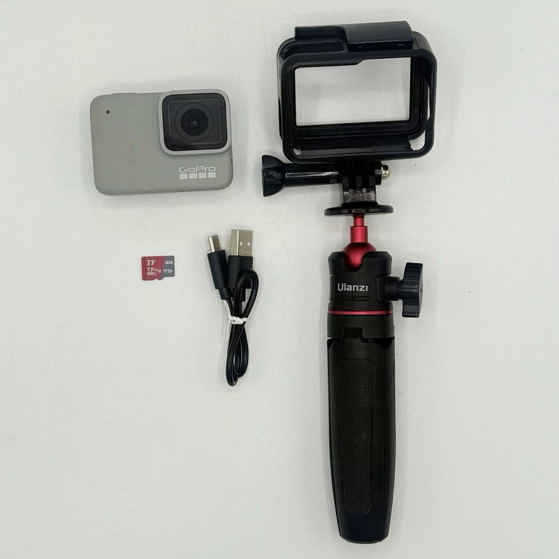 GoPro Hero7 action camera with housing, tripod grip, cables, and memory card