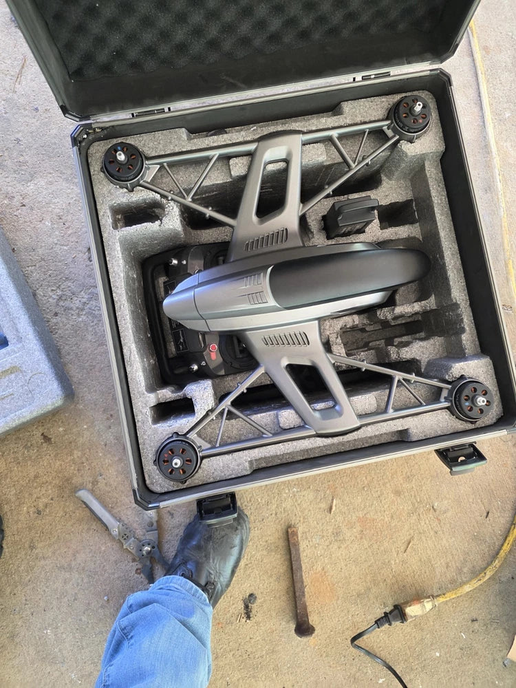 Yuneec Typhoon Q500 drone in gray hard case, with four rotors and landing legs