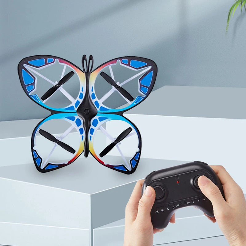 Mini RC drone, butterfly style, blue-and-white wings with LEDs, with handheld remote
