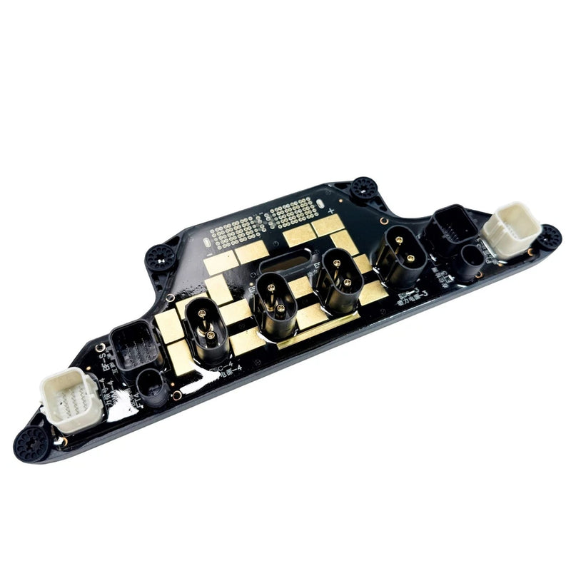 Black power distribution panel module with gold pads and several pin connectors