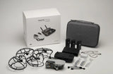DJI Mavic Mini drone kit with carrying case, batteries, and accessory cables