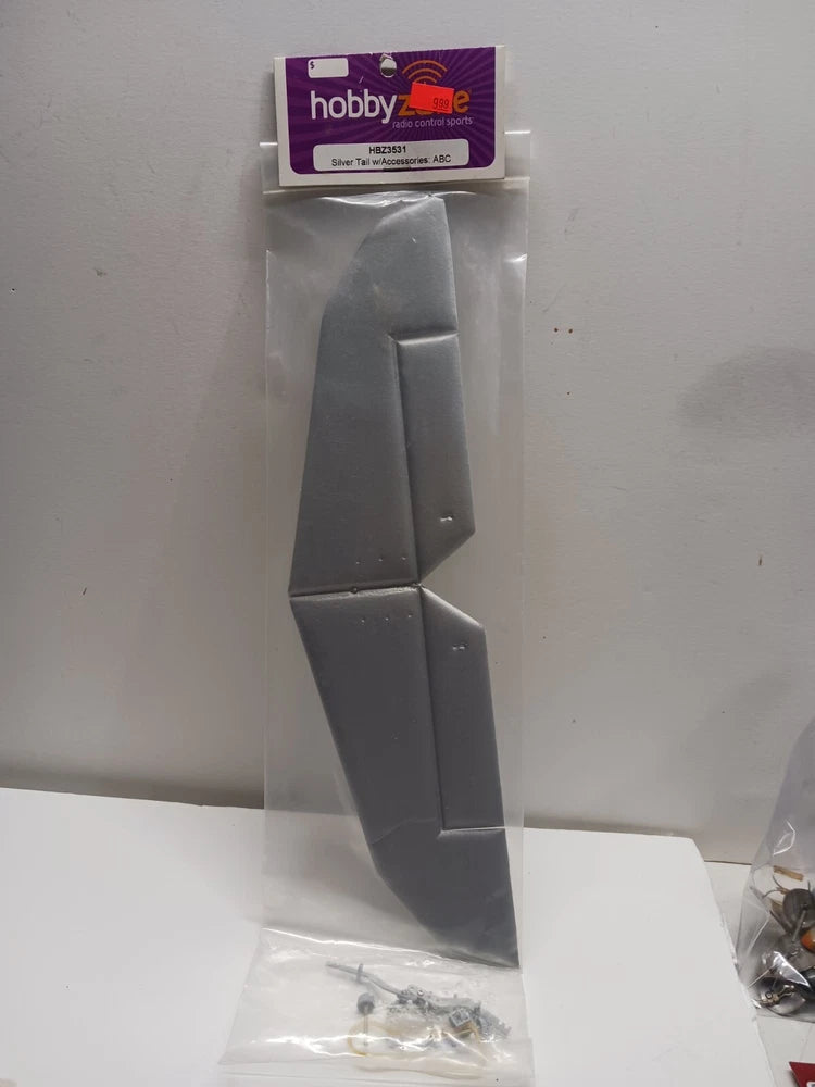 RC plane tail fin set with accessories, dark gray plastic with small hardware bag